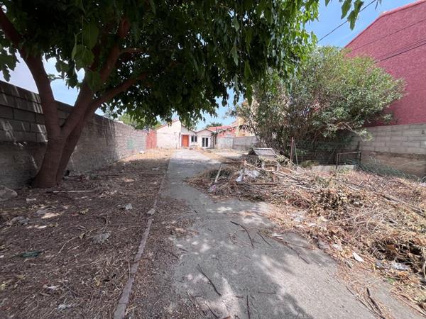 Maison de plain-pied de 95 m² environs avec travaux à prévoir sur un terrain de 509 m² proche de l'aéroport