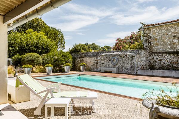 Bâtisse d’époque et de caractère en coeur de village