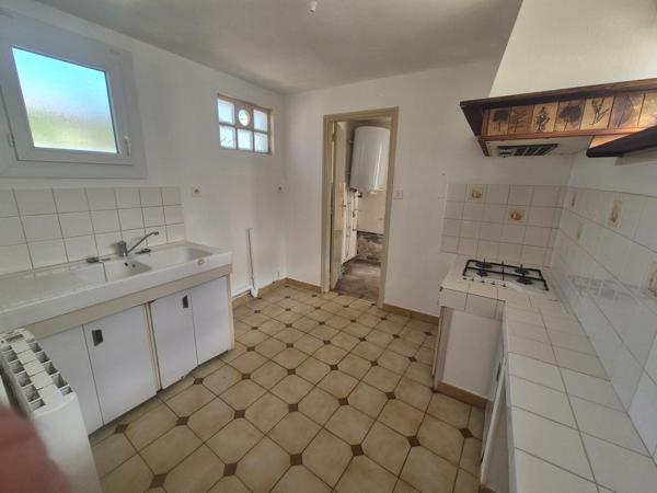 Maison de plain-pied 2 chambres 1 garage 1 jardin proche des commerces