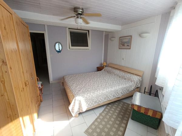 Appartement 3 pièces en rez-de-jardin + parking privé