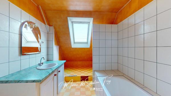 Maison traditionnelle avec beau potentiel proche des commerces