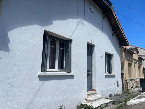A vendre maison mitoyenne  3 pièces de  65 m2 avec grand garage sur terrain de 295 m2