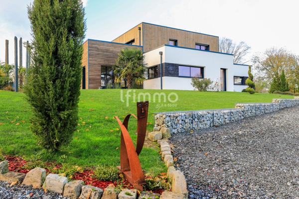 Superbe Maison Moderne sur Terrain Paysagé de 7030 m² – 603 000 €