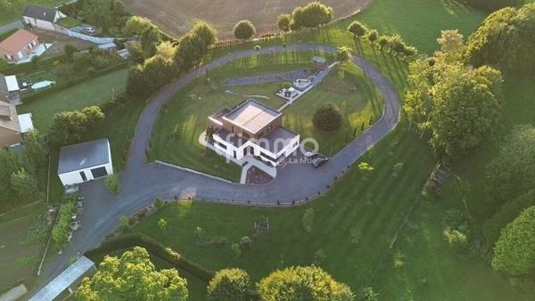 Superbe Maison Moderne sur Terrain Paysagé de 7030 m² – 603 000 €