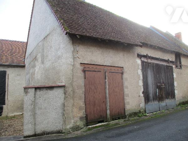 Ensemble immobilier composé de 2 appartements, et dépendances à usage de garages