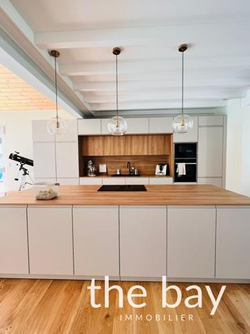 Gujan-Mestras (33470) Gujan-Mestras – Maison de plain-pied aux prestations haut de gamme, avec piscine et grand séjour de 87 m²