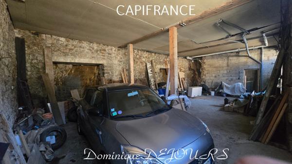 Maison composée de 2 appartements (57 et 43m²) et d'un grand garage de 100m².
