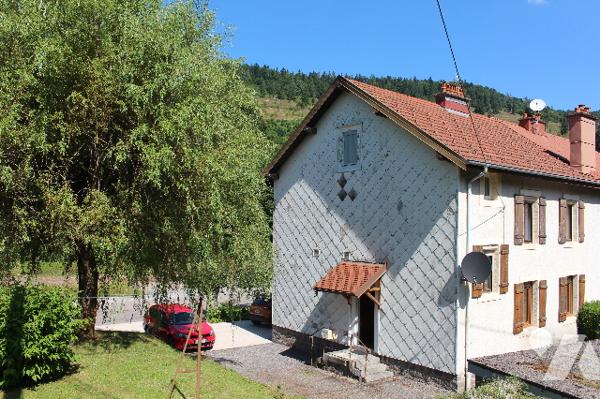 Maison mitoyenne d'env. 130m² habitable  sur 1293m² de terrain avec garage et terrasse couverte
