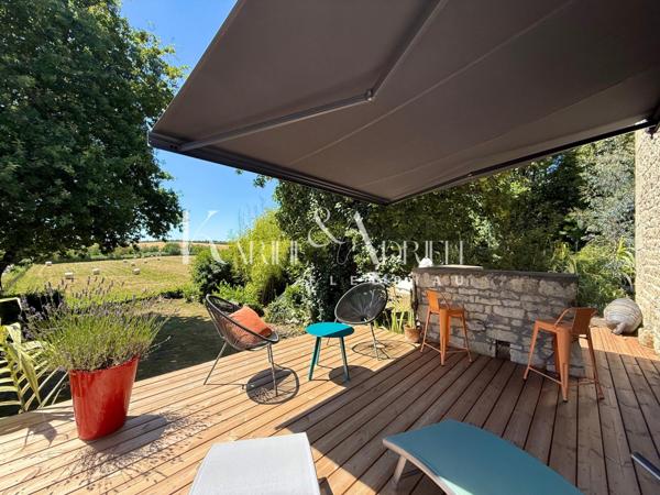 Charme et authenticité pour cette propriété en pierre avec une activité de Gîte