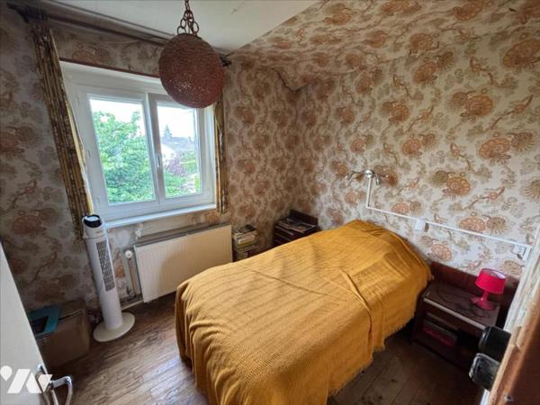 Maison 4 pièces (environ 84 m² habitables) située dans un secteur calme, proche centre