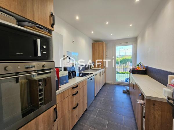 Appartement 75m2 avec grand jardin, garage et 2 parkings+ cave.