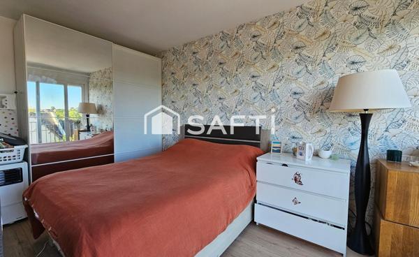 Appartement 75m2 avec grand jardin, garage et 2 parkings+ cave.