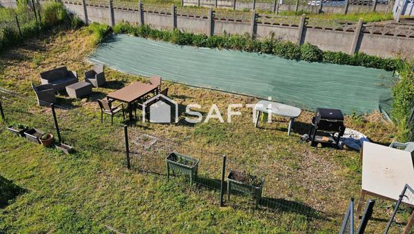 Appartement 75m2 avec grand jardin, garage et 2 parkings+ cave.