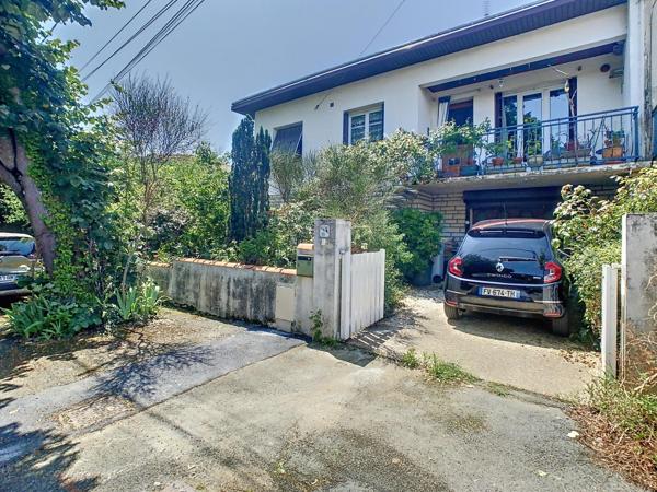 Maison familiale 4 chambres avec jardin, garage et fort potentiel