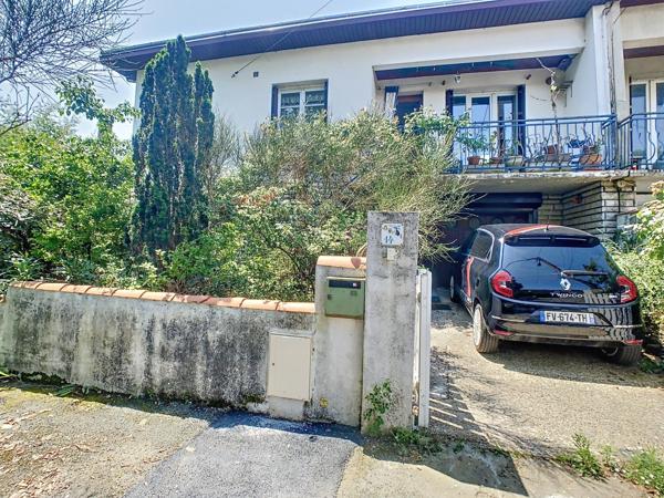Maison familiale 4 chambres avec jardin, garage et fort potentiel