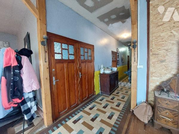 SAINT-GAUDENS, maison de ville avec jardin clôturé et garage proche des commodités à pieds.