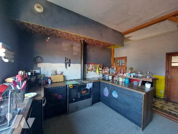 SAINT-GAUDENS, maison de ville avec jardin clôturé et garage proche des commodités à pieds.