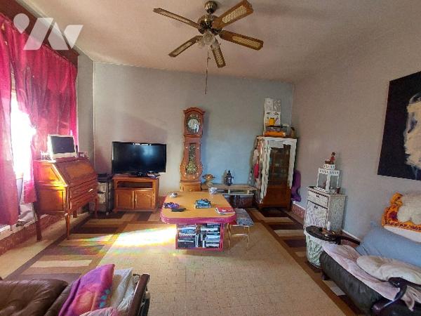 SAINT-GAUDENS, maison de ville avec jardin clôturé et garage proche des commodités à pieds.