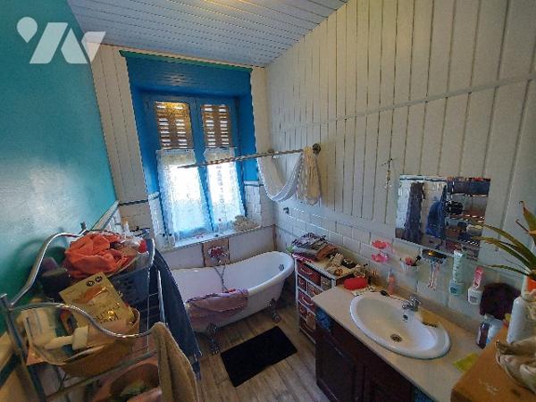 SAINT-GAUDENS, maison de ville avec jardin clôturé et garage proche des commodités à pieds.