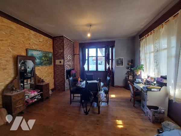 SAINT-GAUDENS, maison de ville avec jardin clôturé et garage proche des commodités à pieds.