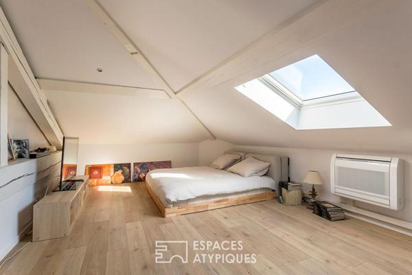 Duplex rénové avec balcon dans une bâtisse