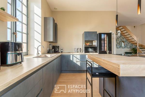 Duplex rénové avec balcon dans une bâtisse