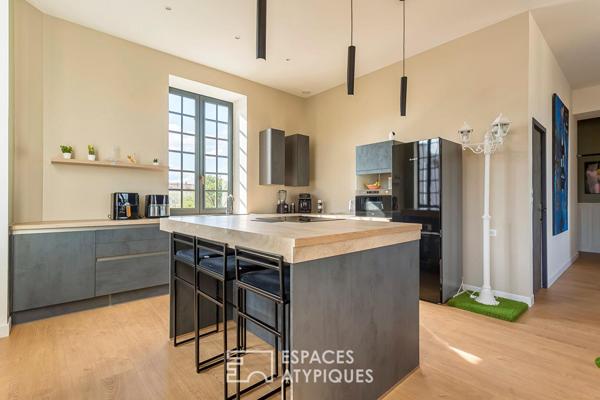 Duplex rénové avec balcon dans une bâtisse