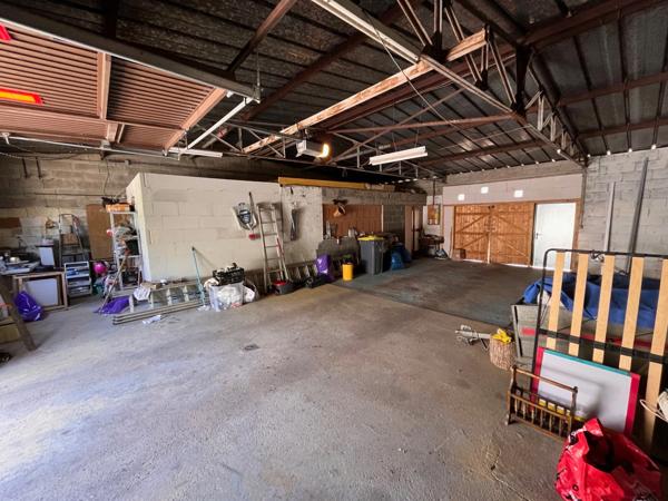 Maison familiale atypique avec grand garage attenant