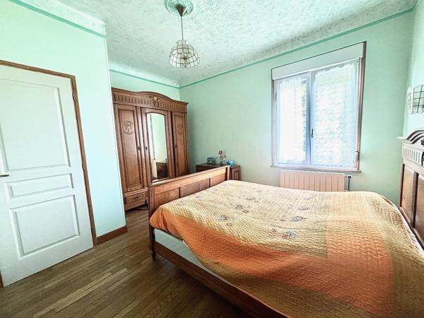 Maison jumelée avec un magnifique jardin arboré