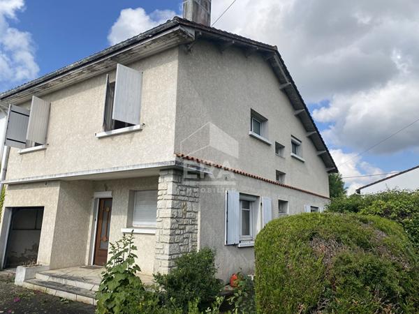 Maison familiale avec jardin, garage et fort potentiel d'aménagement
