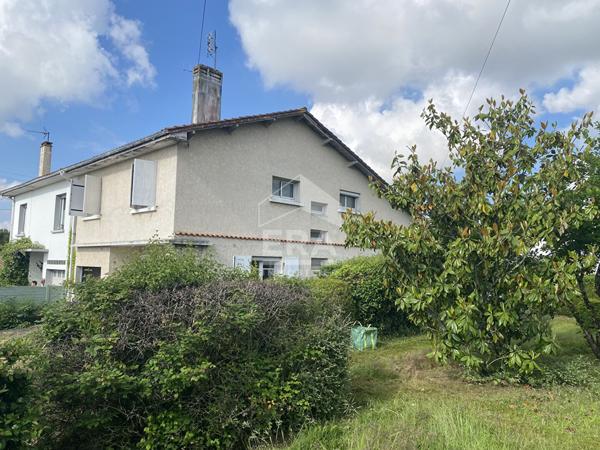 Maison familiale avec jardin, garage et fort potentiel d'aménagement