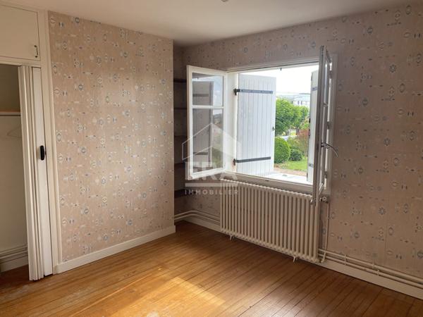 Maison familiale avec jardin, garage et fort potentiel d'aménagement