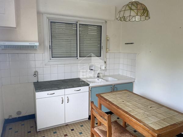 Maison familiale avec jardin, garage et fort potentiel d'aménagement
