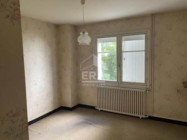 Maison familiale avec jardin, garage et fort potentiel d'aménagement