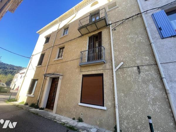 Maison de ville avec local commercial et garage investissement
