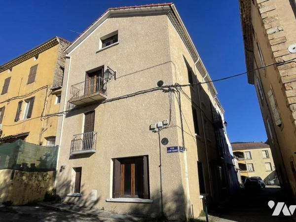 Maison de ville avec local commercial et garage investissement