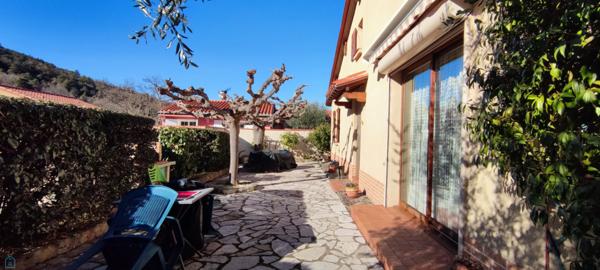 Maison 4 faces avec jardin et garage