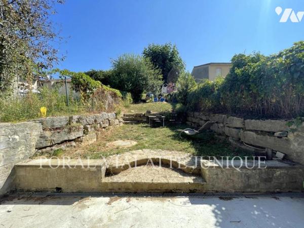 Maison avec jardin en plein centre-ville