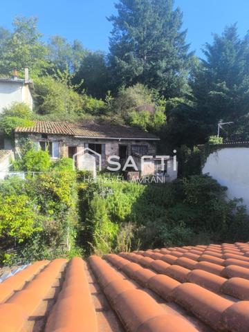 Immeuble de rapport avec extérieur, garage, ateliers, jardin, caves