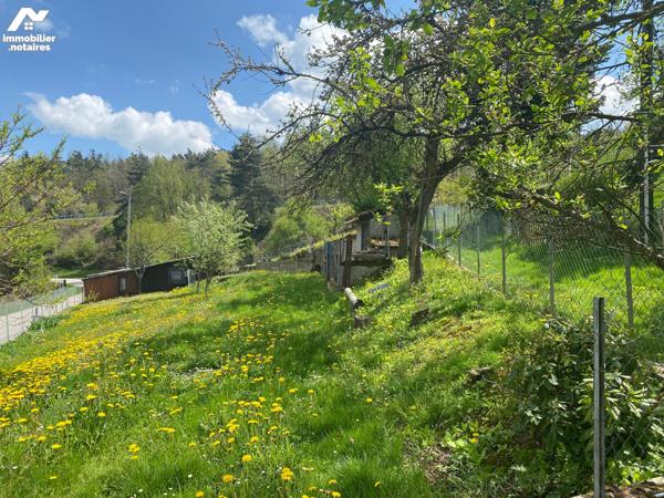 Terrain pentu de 1500m² exposé Sud-ouest avec vue