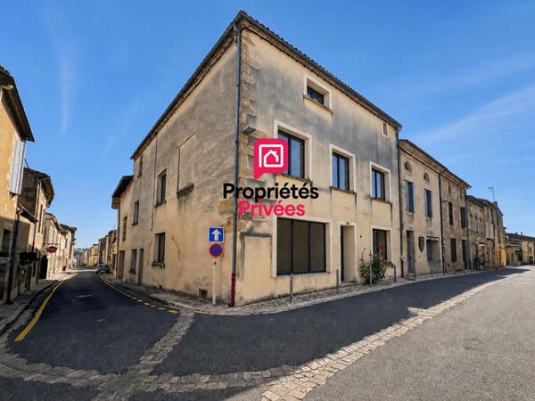 Immeuble en pierre avec garage, cour privative et fort potentiel d'aménagement