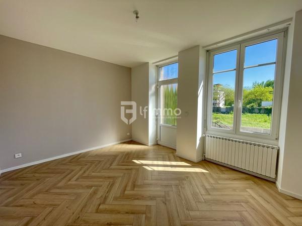 Sous compromis : Rez de jardin rénové dans une maison de Maître