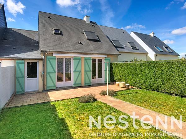 Maison avec garage et jardin à deux pas du centre-ville