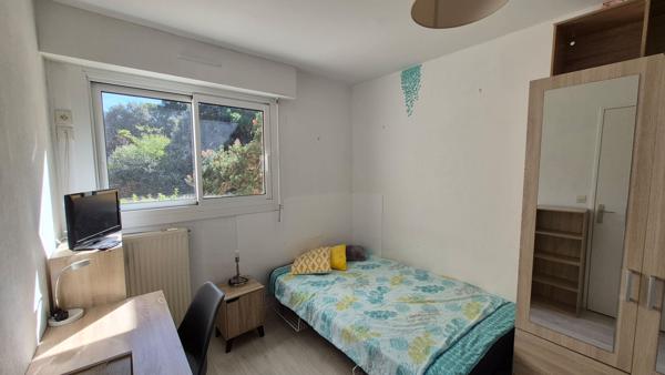 Appartement T3 avec balcon, stationnement couvert et cave