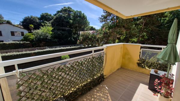 Appartement T3 avec balcon, stationnement couvert et cave