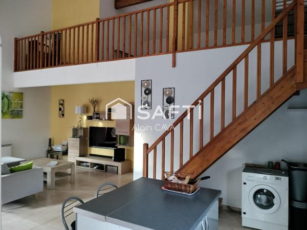Appartement de 121m² avec mezzanine terrasse et parking dans une maison divisée en 2 logments