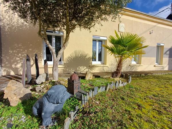 Maison - plain pied - grands garages dont accueil camping car