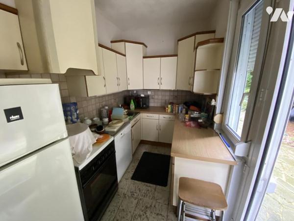 Maison de ville 4 chambres jardin et garage.