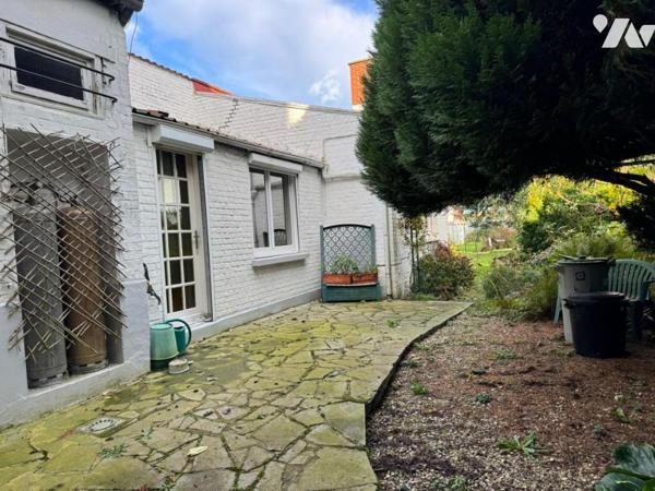 Maison de ville 4 chambres jardin et garage.