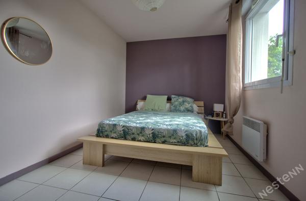 AGEN - Appartement T3 lumineux de 69 m² avec terrasse couverte, ascenseur et place de parking en sous-sol.